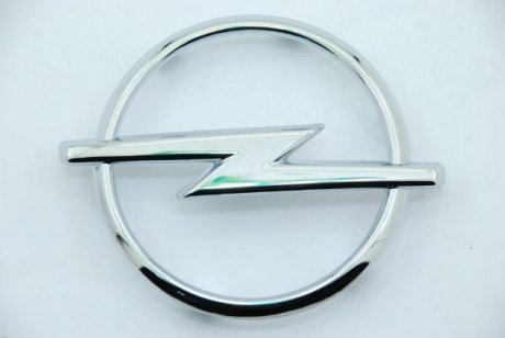 Эмблема решетки радиатора Opel 1324033 (фото 1)